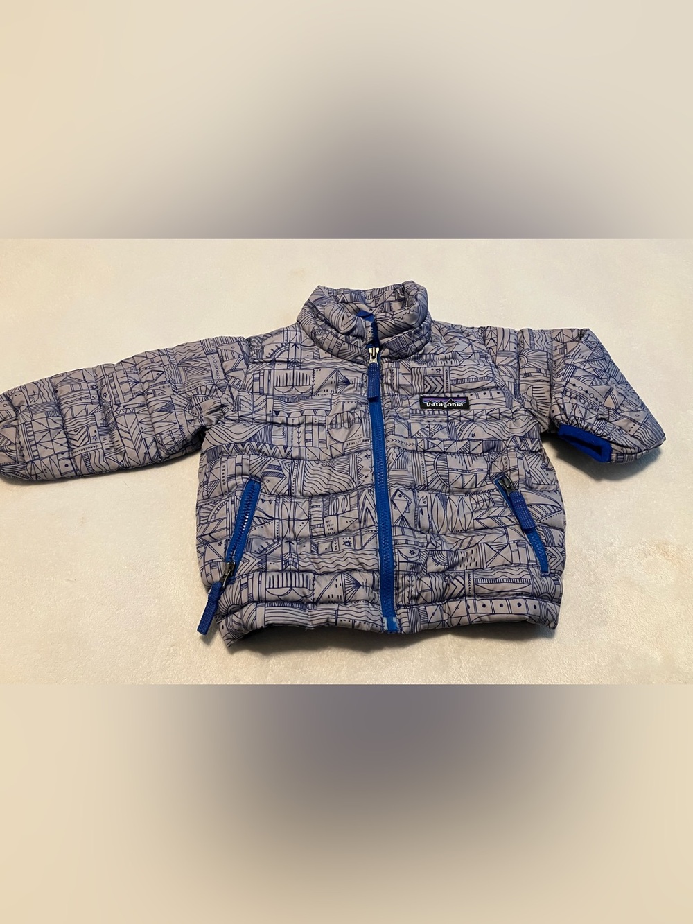 Patagonia Toddler Quilted Puffer Jacket in Light Gray with Blue Trim